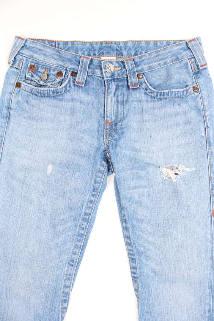 Vintage Y2K True Religion blue low rise flared jeans with orange contrast stitching. 