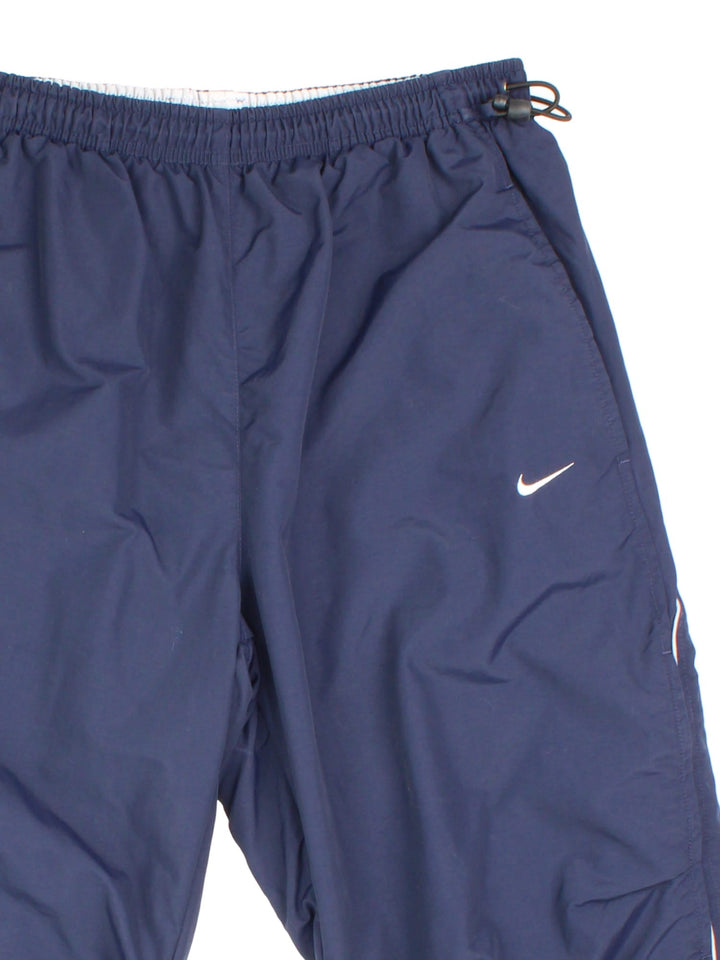 Y2K 3/4 Length Nike shorts in blue colourway. Elasticated waist and draw string hem