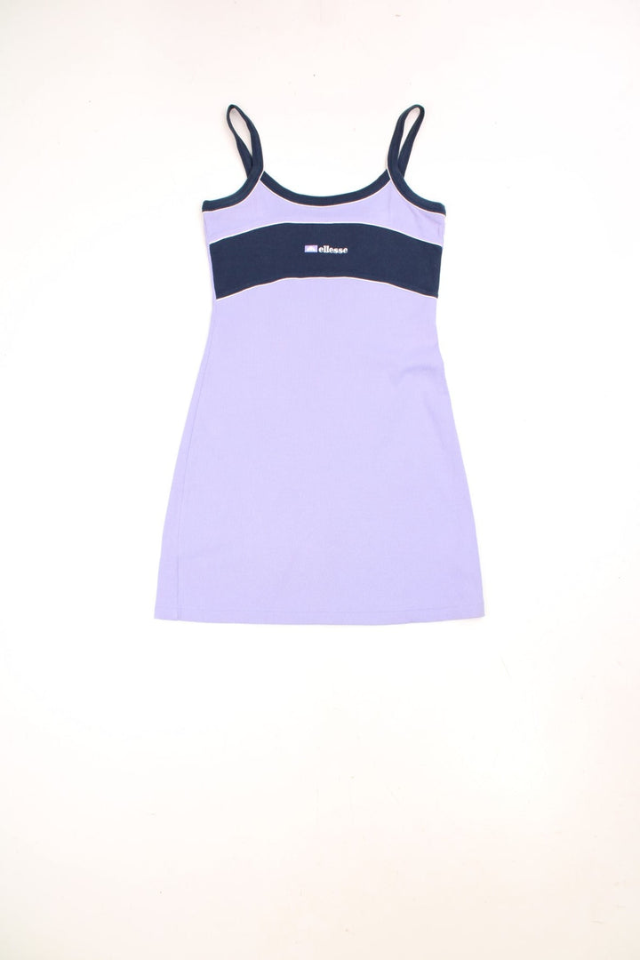 Y2K Ellesse sporty mini dress in lilac with navy blue accents, white piping and an embroidered logo on the chest. 