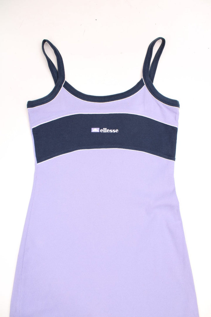 Y2K Ellesse sporty mini dress in lilac with navy blue accents, white piping and an embroidered logo on the chest. 