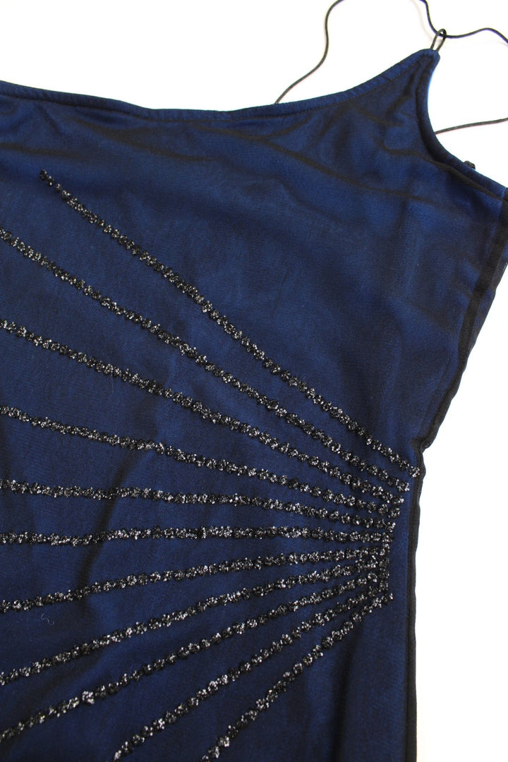 Y2K New Look dress in blue with a sheer black outer layer, a strappy asymmetrical neckline and hem, and black bead detailing.