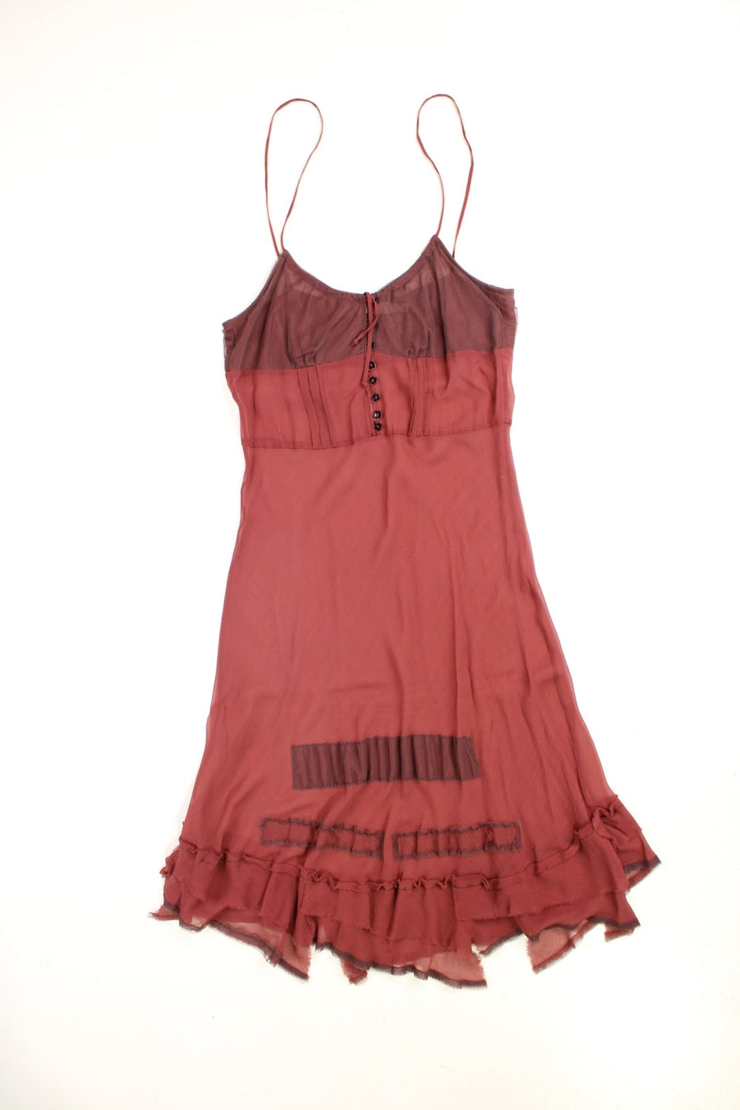 Y2K sheer strappy slip dress in red with buttons, adjustable straps, and a distressed ruffled hem .