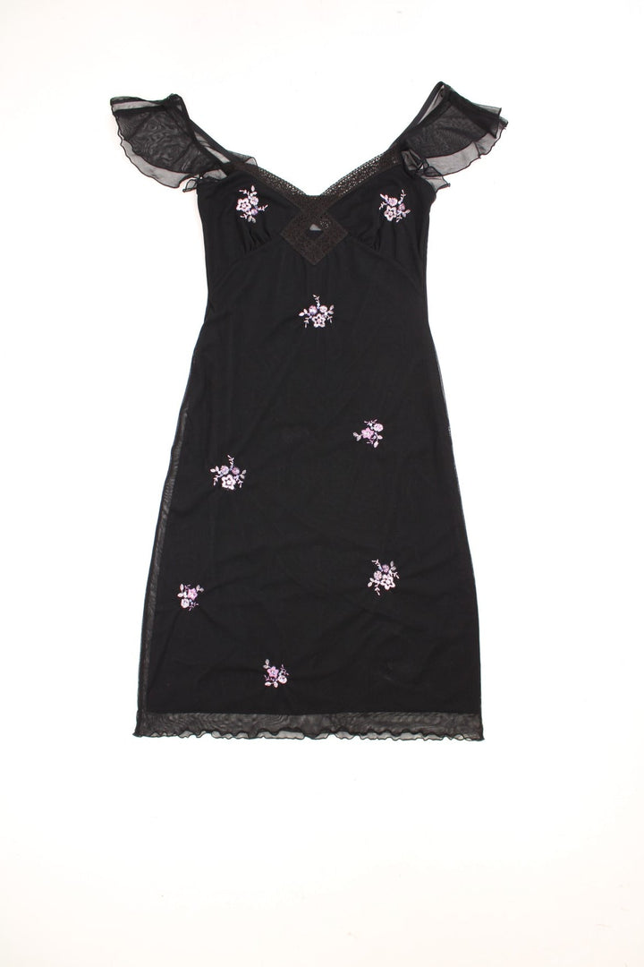 Y2K black v-neck midi dress with lace trim, floral embroidery in pink, and sheer flutter sleeves.  