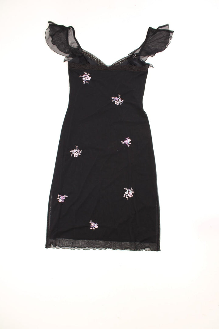 Y2K black v-neck midi dress with lace trim, floral embroidery in pink, and sheer flutter sleeves.  