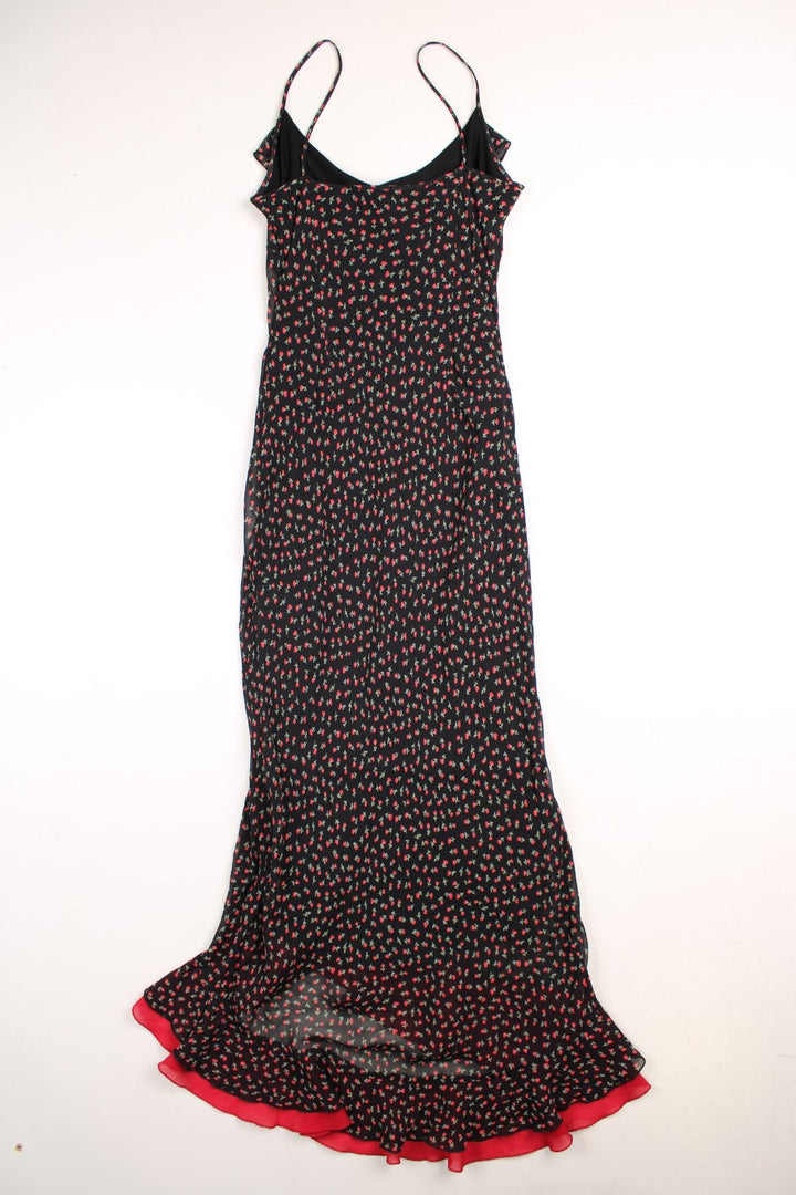 Y2K Bay strappy maxi dress in black with a red ditsy floral print and ruffles at the bust and hem.