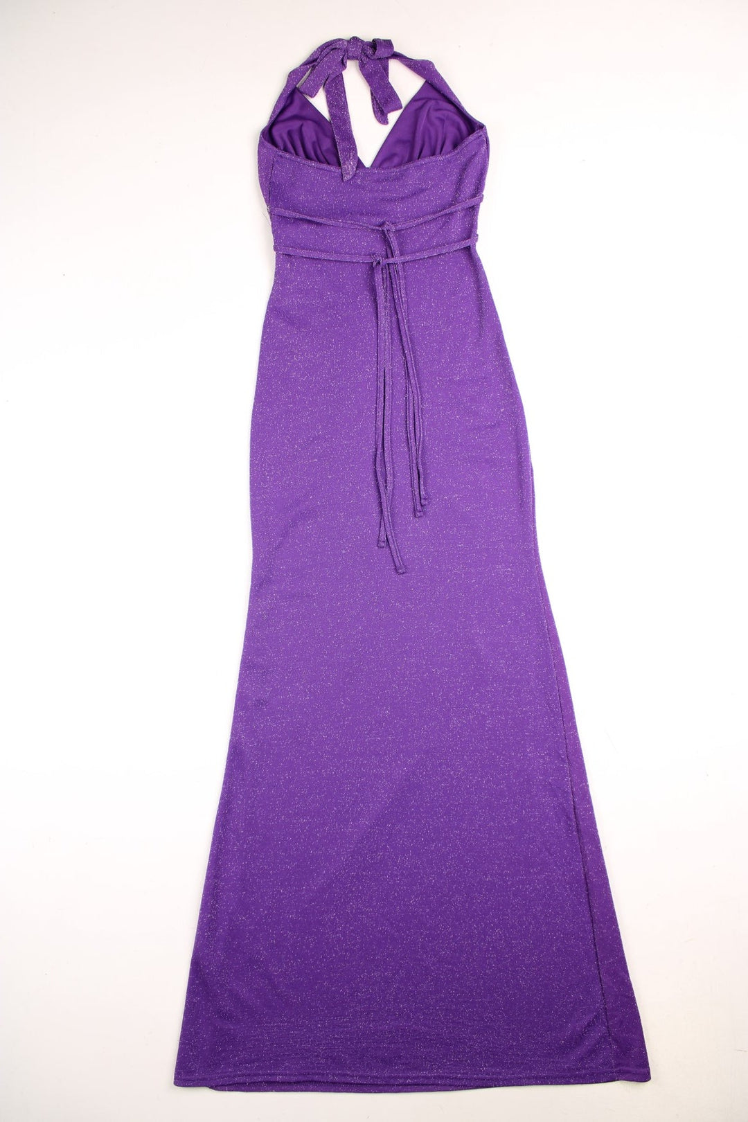 Y2K Jane Norman dress in a glittery purple stretch fabric, with a halter neck, two ties at the back, and sparkly silver detailing under the bust.