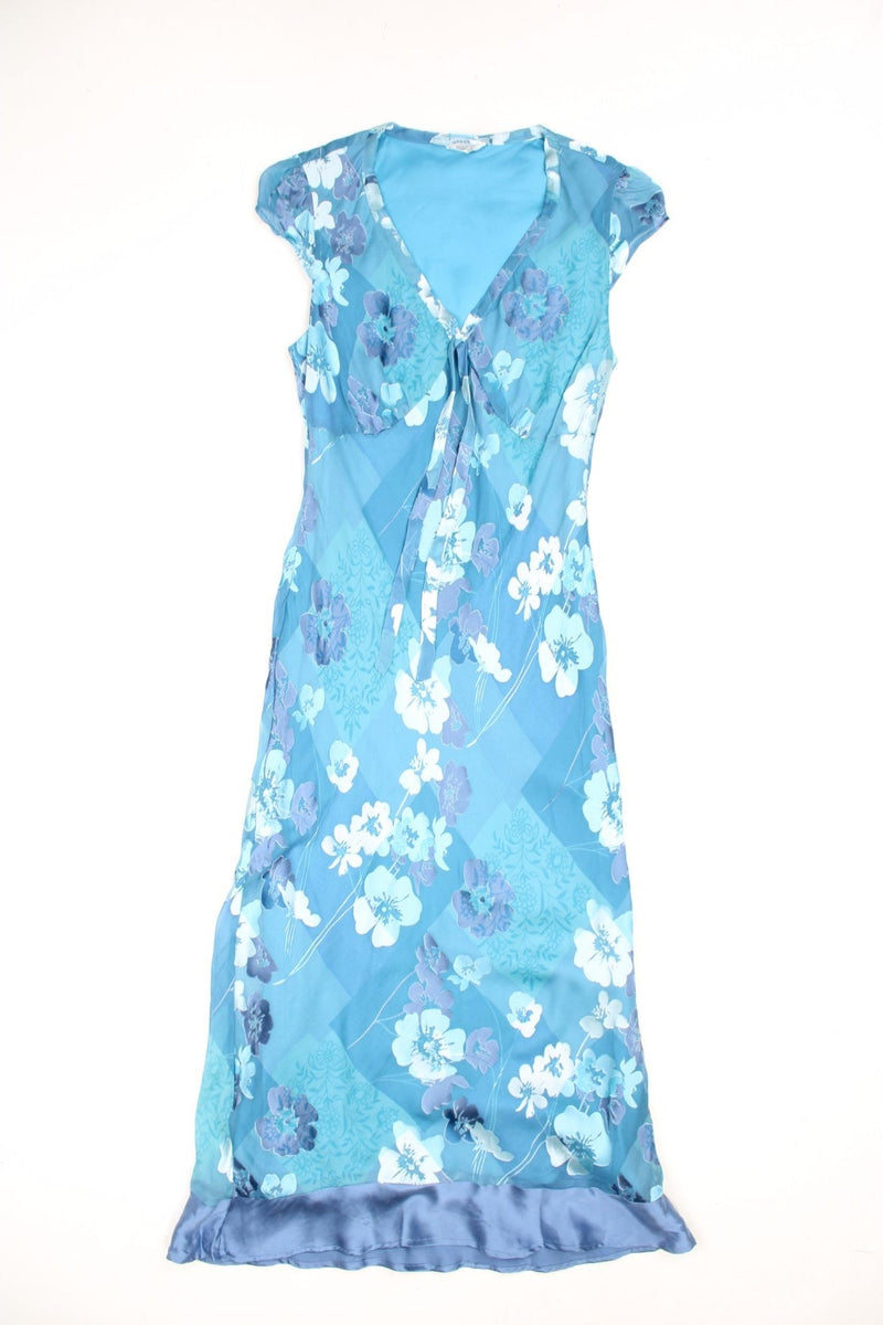 Y2K capped sleeve, floral silk and mesh midi dress in turquoise blue. Features ruffle silk hem and tie on the chest.