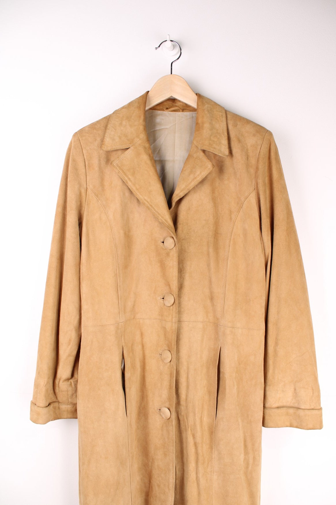 Y2K suede trench jacket in tan with two pockets and button closure. 