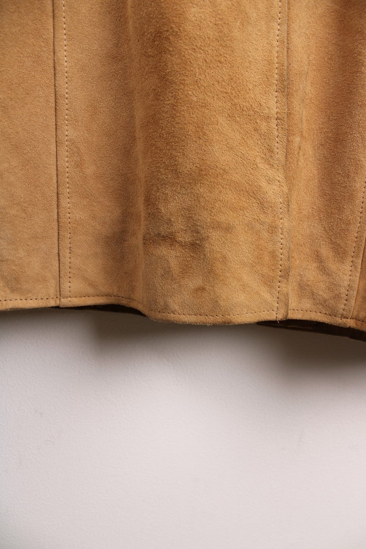 Y2K suede trench jacket in tan with two pockets and button closure. 