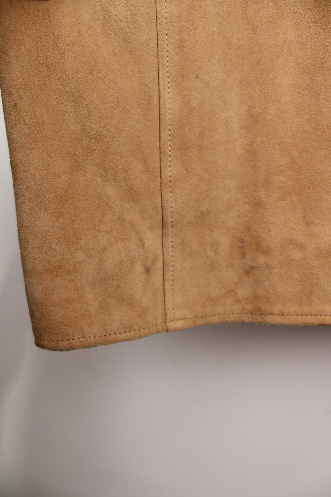 Y2K suede trench jacket in tan with two pockets and button closure. 