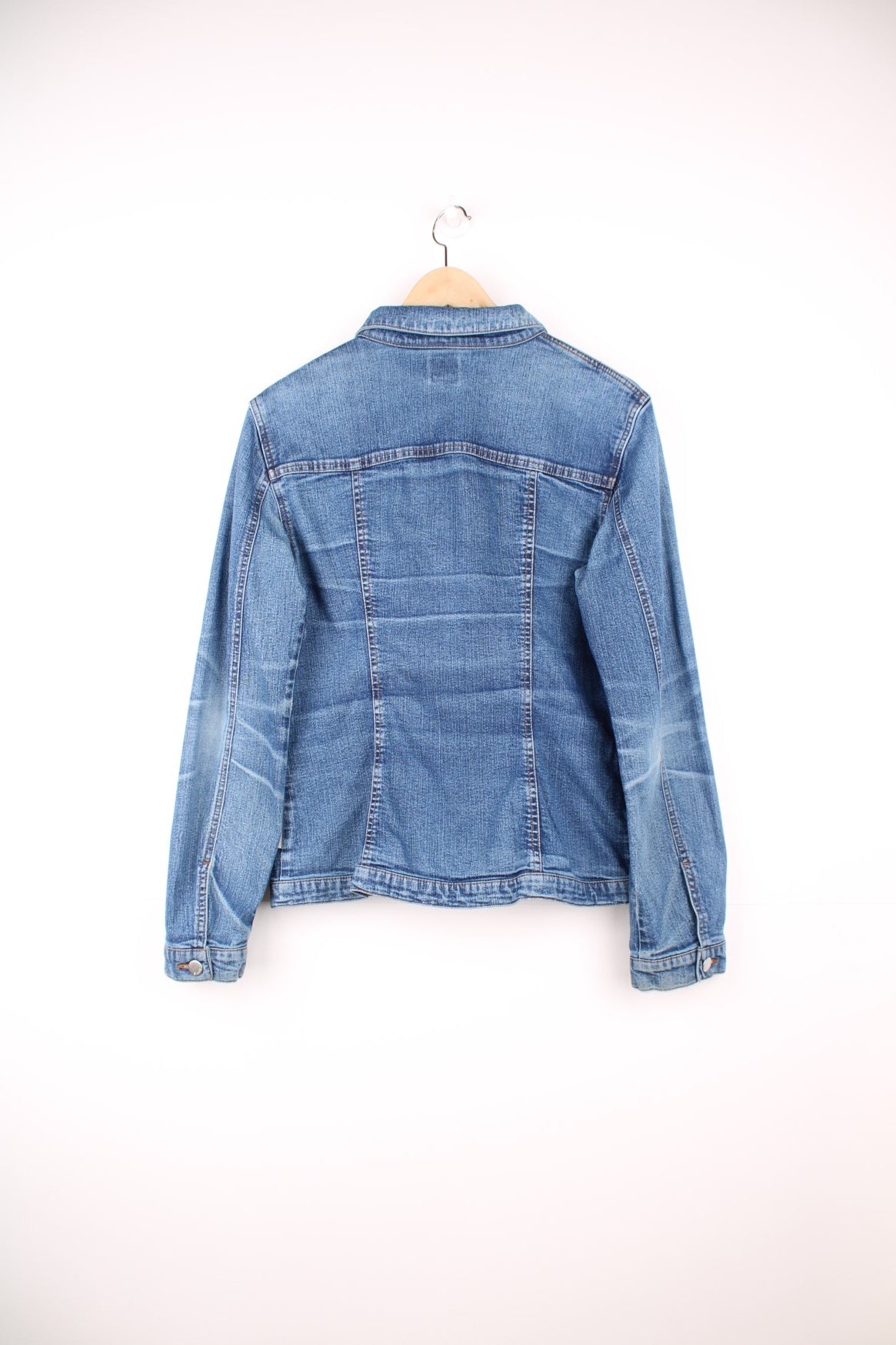 Blue denim jacket by Miss Sixty with button closure and two flap pockets. With small Miss Sixty tags on the chest and lower back hem. 