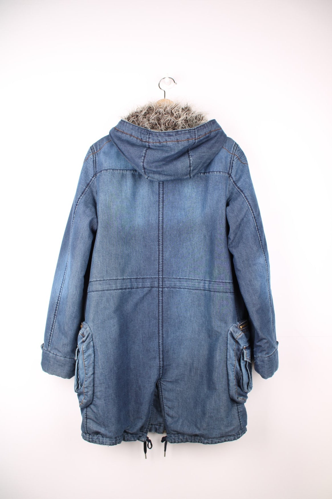 Blue Miss Sixty denim parka with faux fur lined hood, zip closure, eight zip, snap and buckle pockets. 