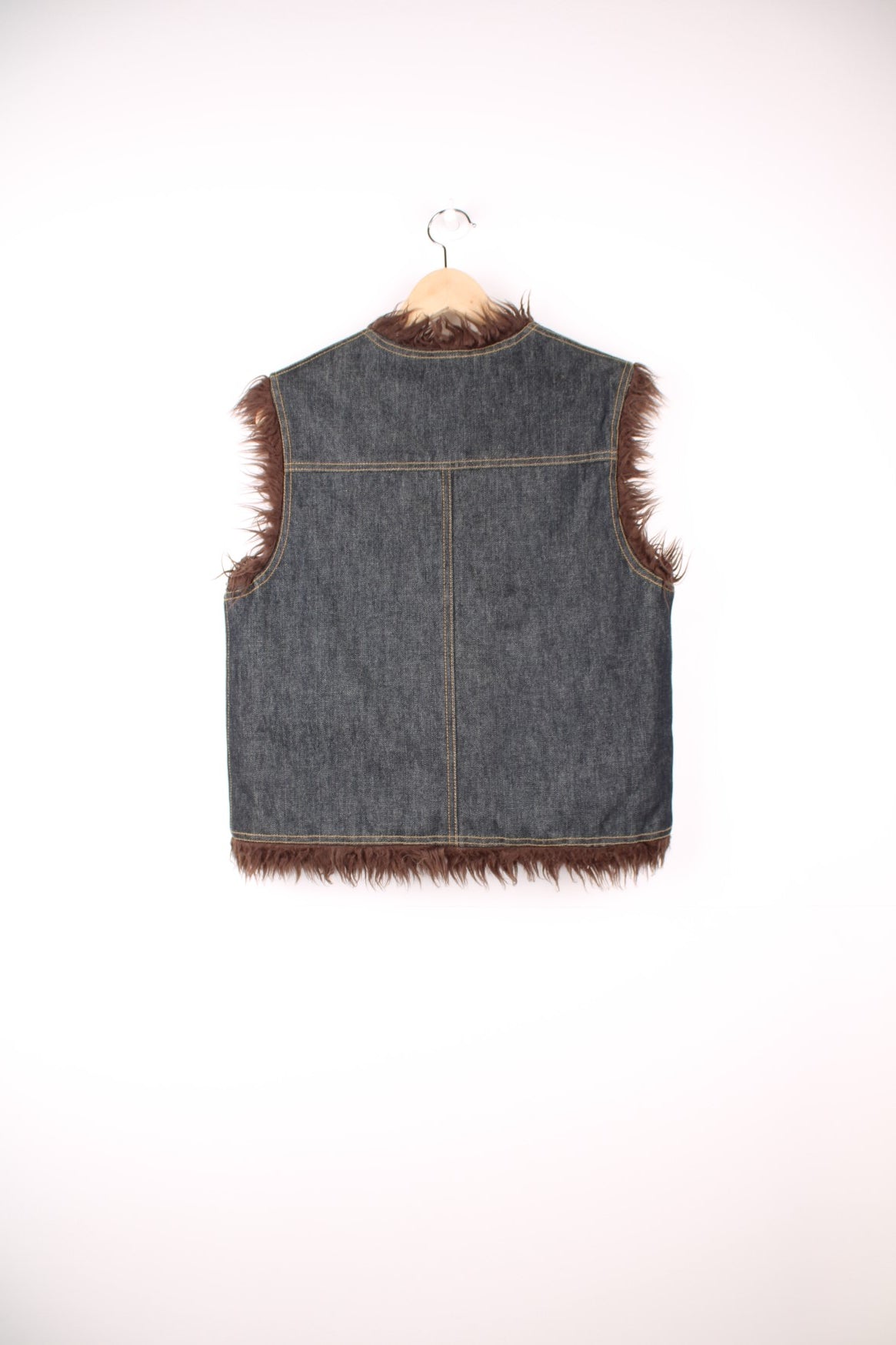 Y2K blue denim vest with brown faux fur lining, two patch pockets and hook closure.