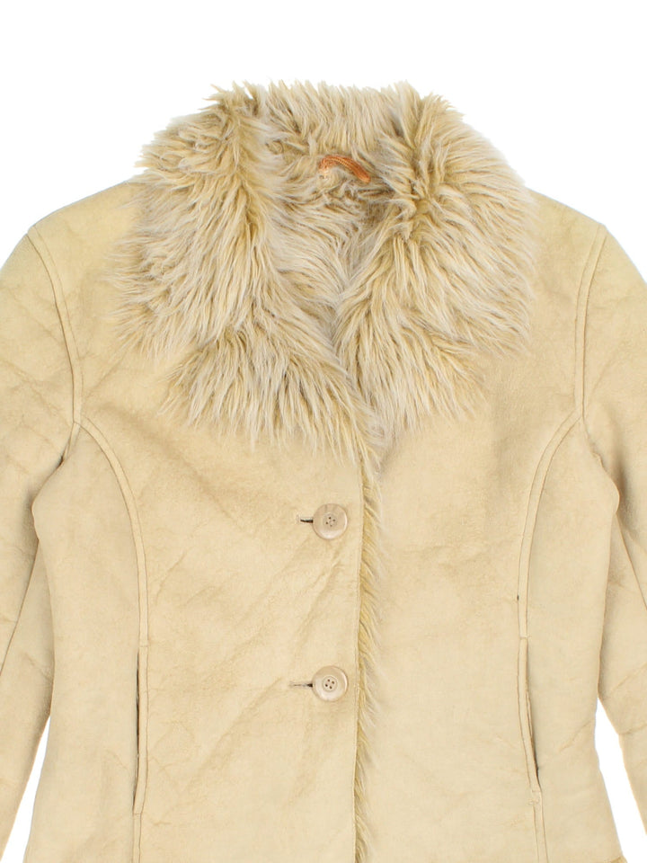 Y2K suede-effect cropped afghan jacket in tan with faux fur trim, two pockets, and button closure.