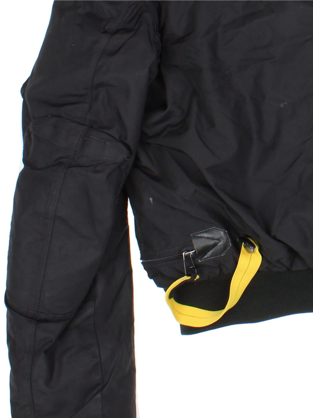 Parajumpers Gobi down coat in black with multiple utility pockets, a velcro logo patch, fur-lined hood, and a PJS carabiner attached.