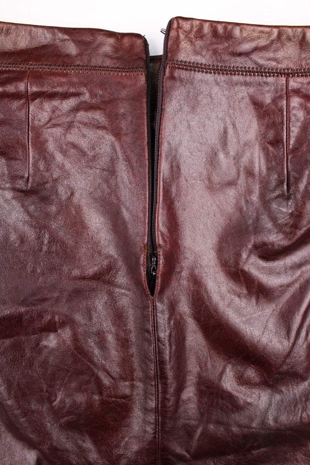 Vintage GAP Leather skirt in brown colourway, high wiasted with a cross stitching block design.