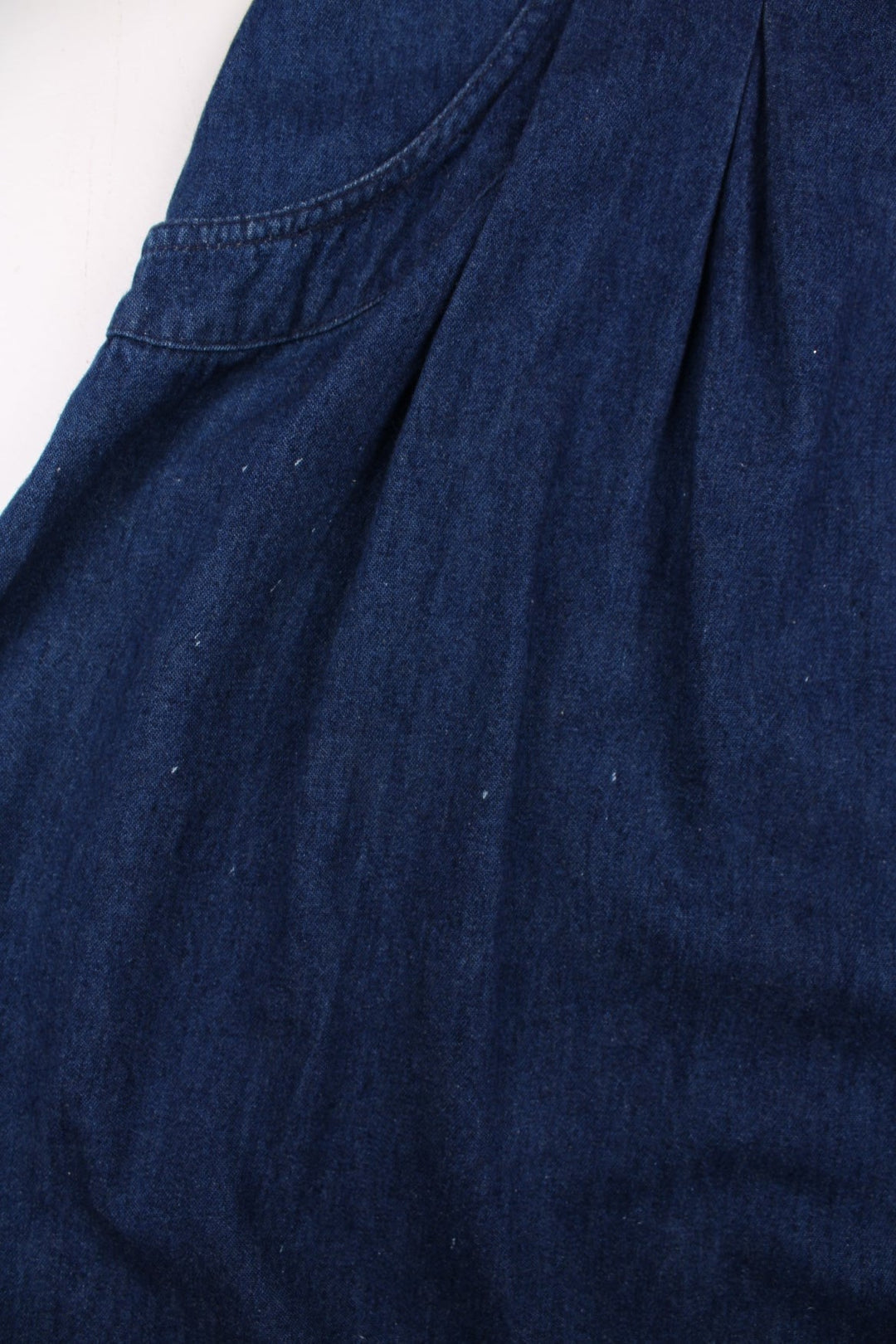 Vintage Denim Skirt in blue colourway with floral bead patterns embroidered on the hem, high waisted and has side pockets.