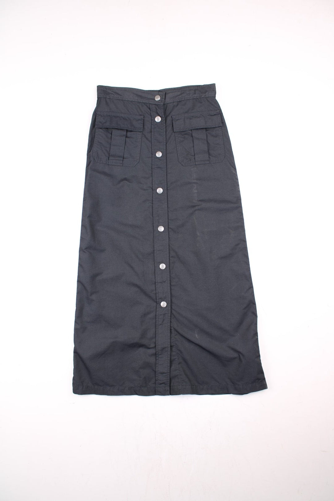 Y2K Calvin Klein Midi Skirt in black colourway, button up with pockets on the front and has the logo embroidered on the back.