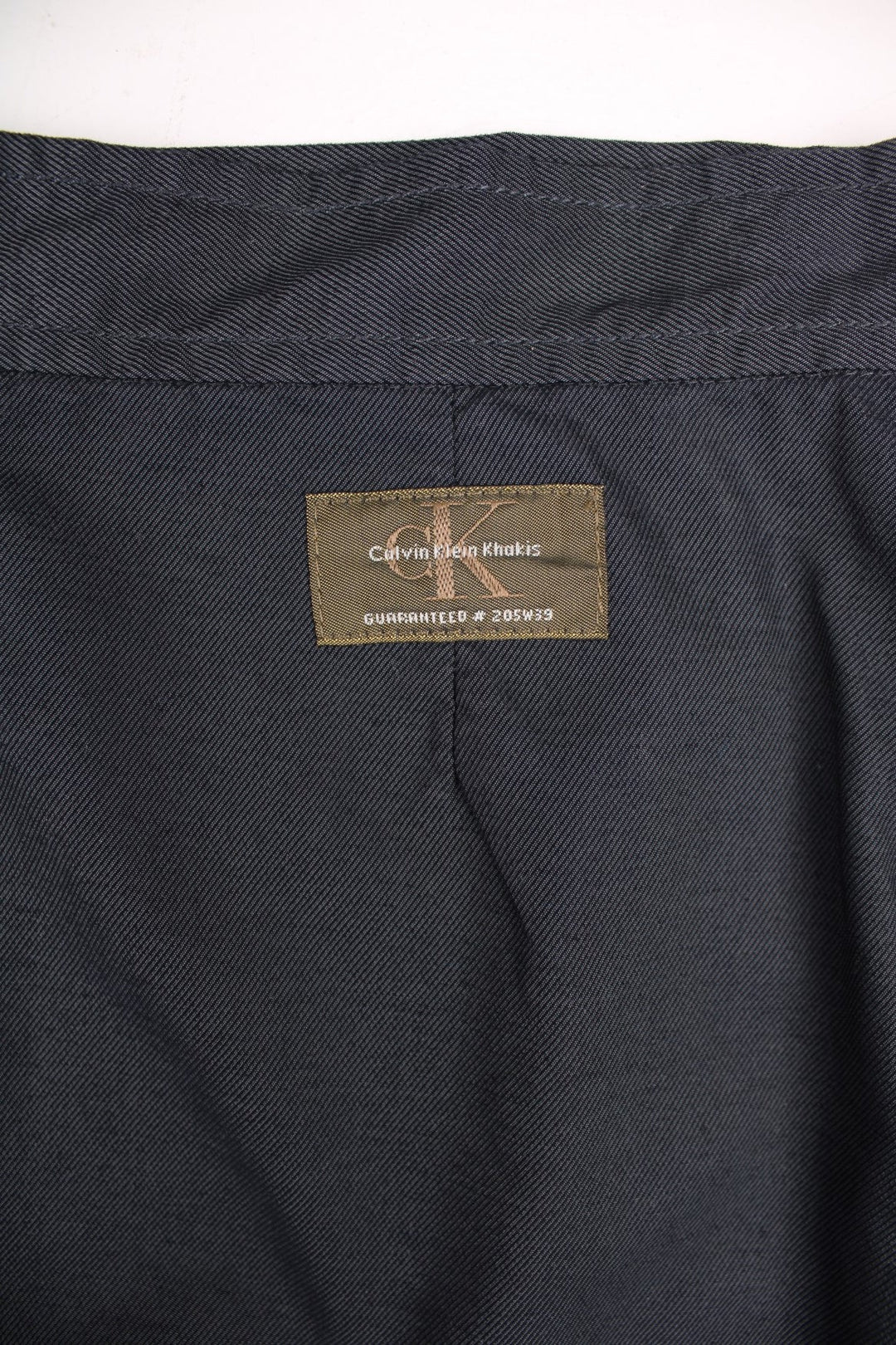 Y2K Calvin Klein Midi Skirt in black colourway, button up with pockets on the front and has the logo embroidered on the back.