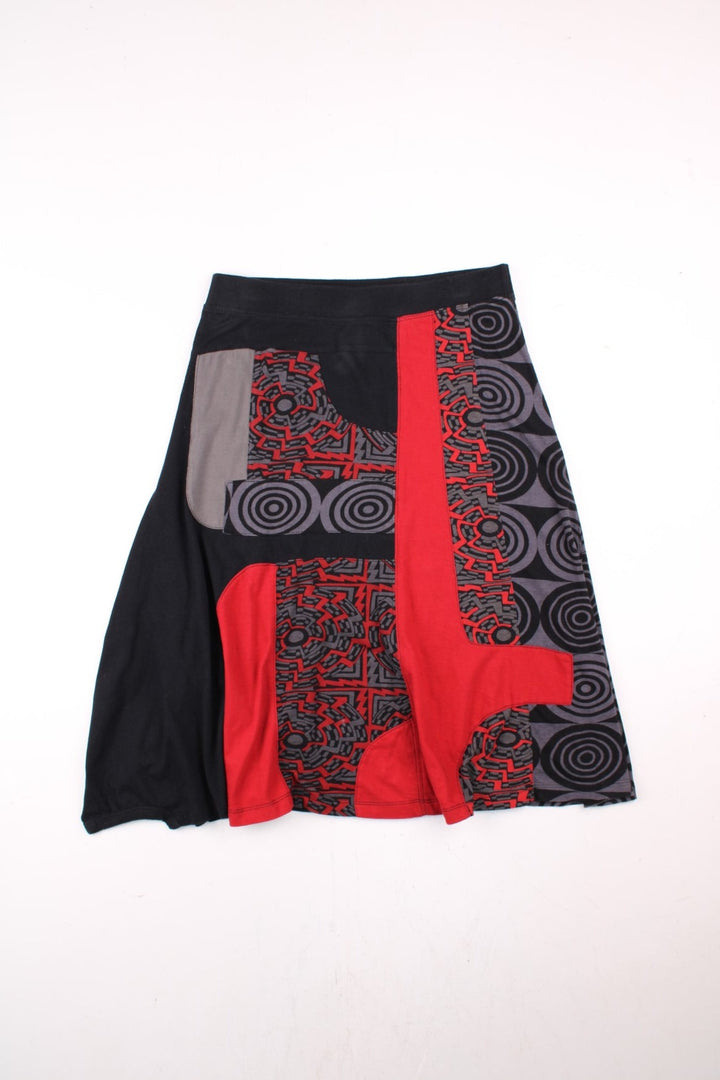 Y2K Desigual Patterned Skirt in black, grey and red colourway and has 'Classic is nothing' spell out printed on the back.