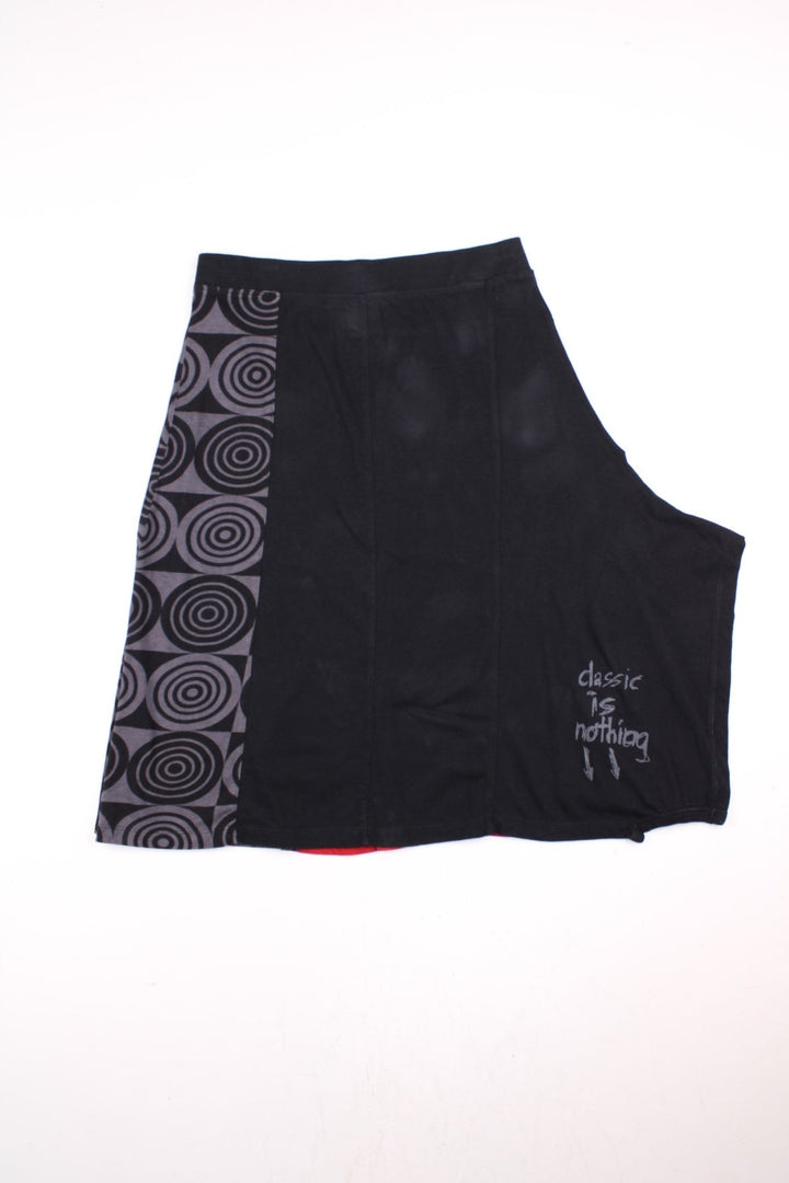 Y2K Desigual Patterned Skirt in black, grey and red colourway and has 'Classic is nothing' spell out printed on the back.