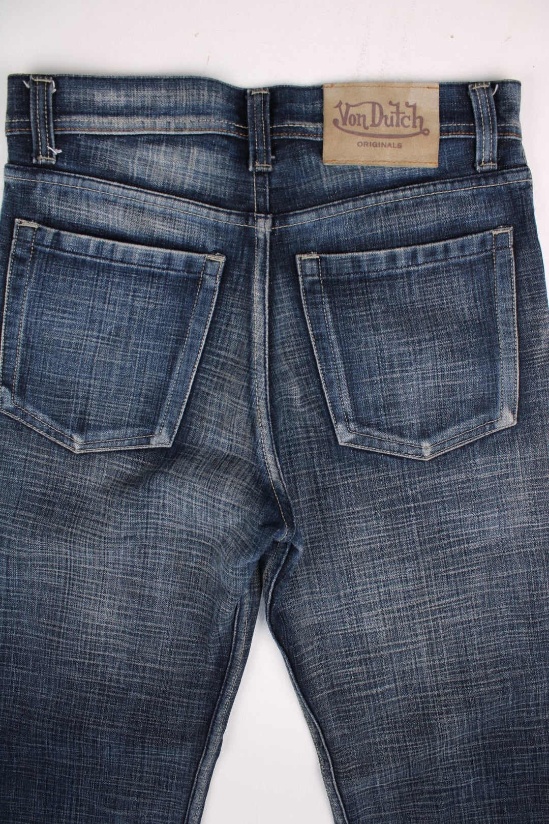 Von Dutch low rise jeans in blue denim colourway with pockets and the logo embroidered on the back.