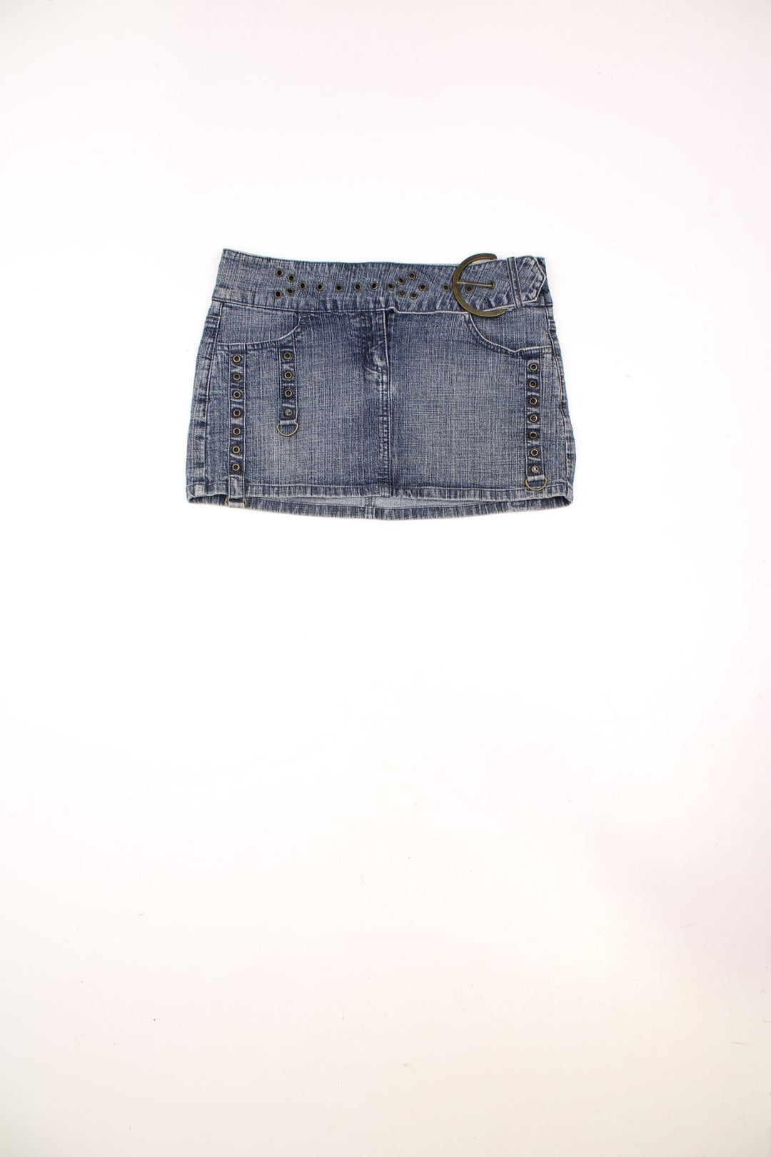 Y2K Moto by Topshop denim mini skirt with zip closure, rivet detailing, front and back pockets, and an attached belt with a large circular buckle. 