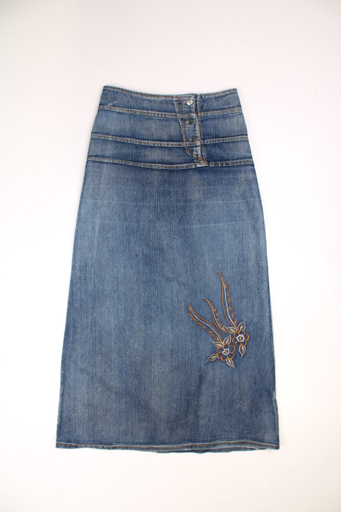 Y2K denim maxi skirt by Cheer Up, with button closure and floral embroidery.  