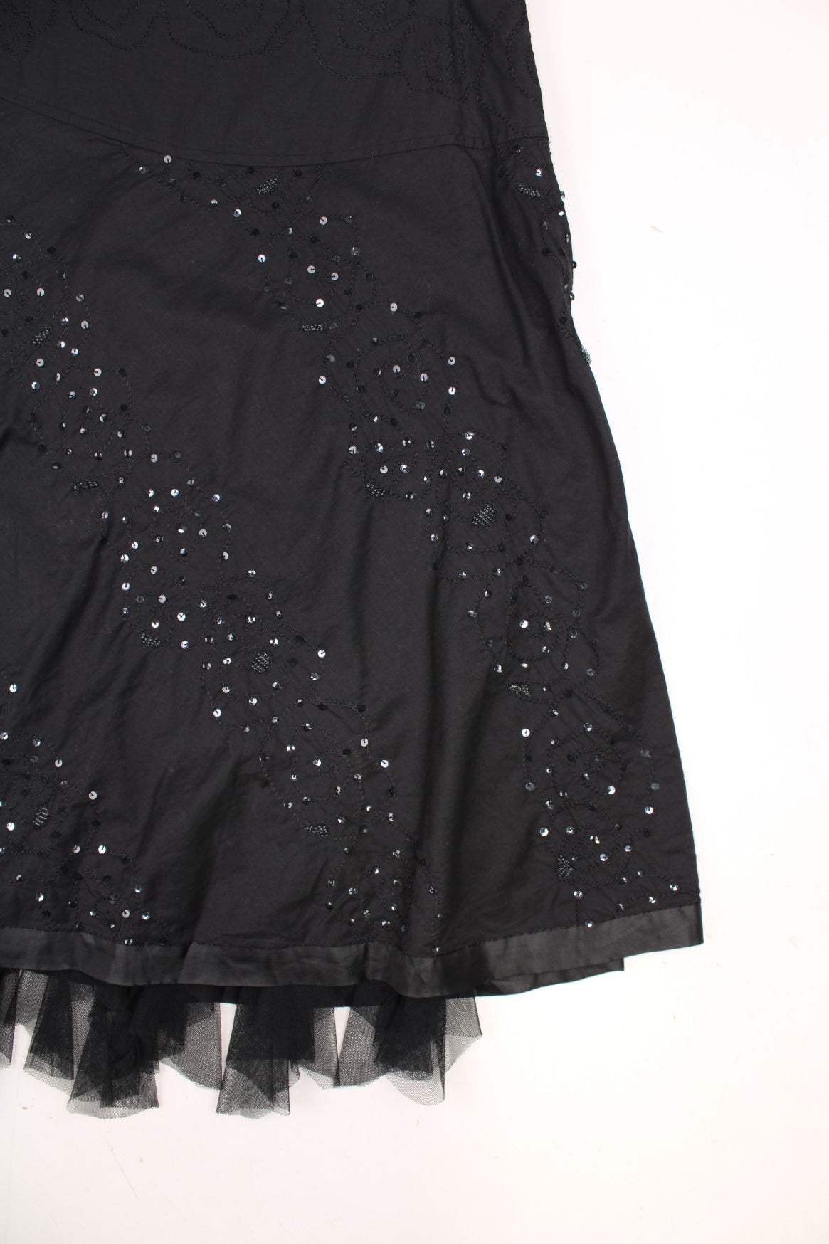 Y2K black skirt with tulle-hemmed underskirt and floral sequined embroidery. 