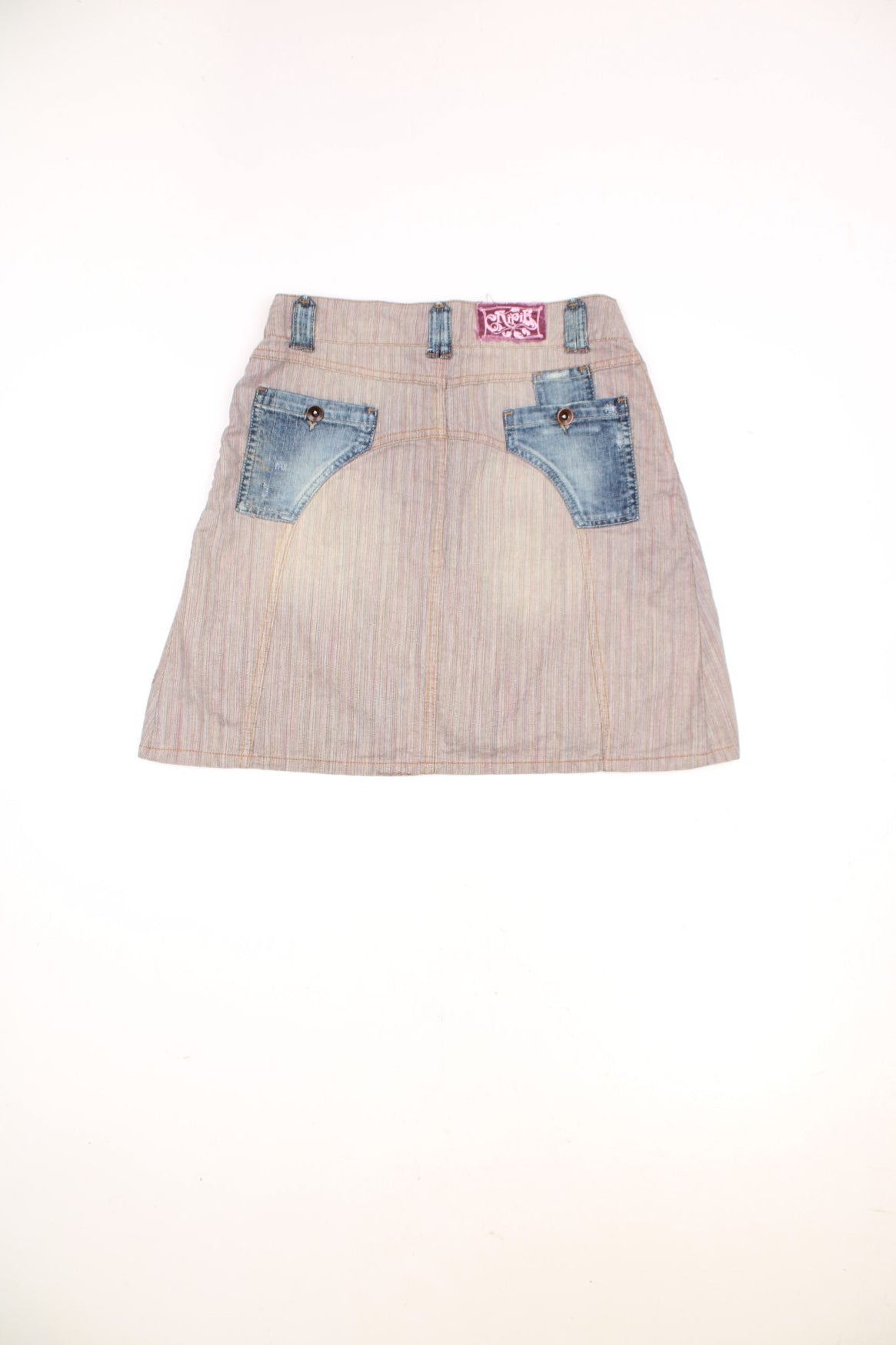 Y2K tan herringbone denim mini skirt by Chipie with blue denim accents, button closure, buckle detailing, front and back pockets, and a pink embroidered logo patch on the back. 