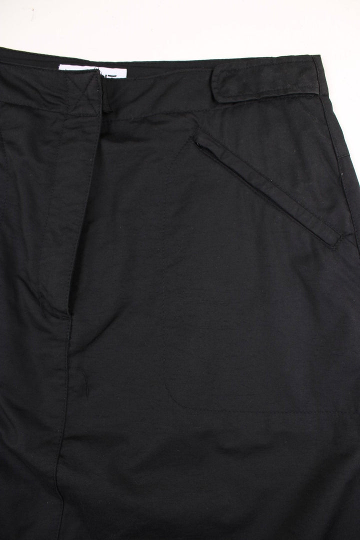 Y2K midi skirt in black with zip pockets.