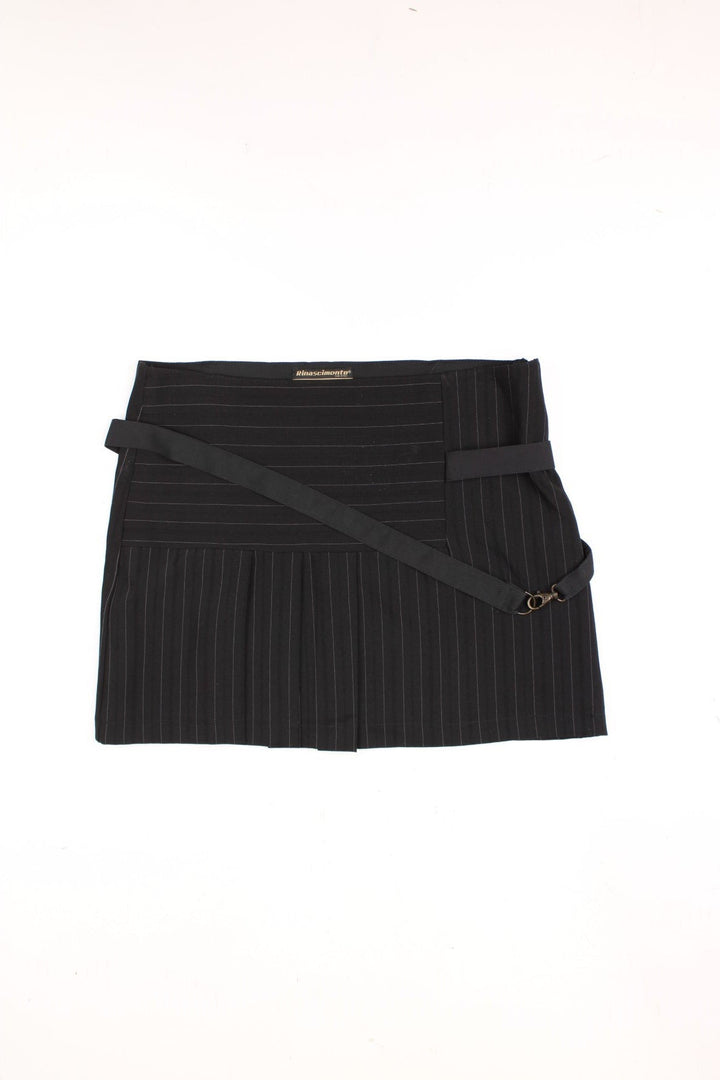 Y2K pleated and pinstripe mini skirt in black with strap detail.