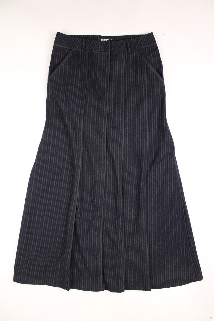 Vintage DKNY maxi skirt in black pinstripe. Featuring pockets and belt detail.