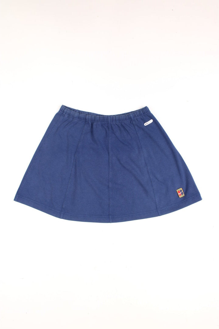 Vintage Nike mini skirt in navy with logo embroidered on the front.