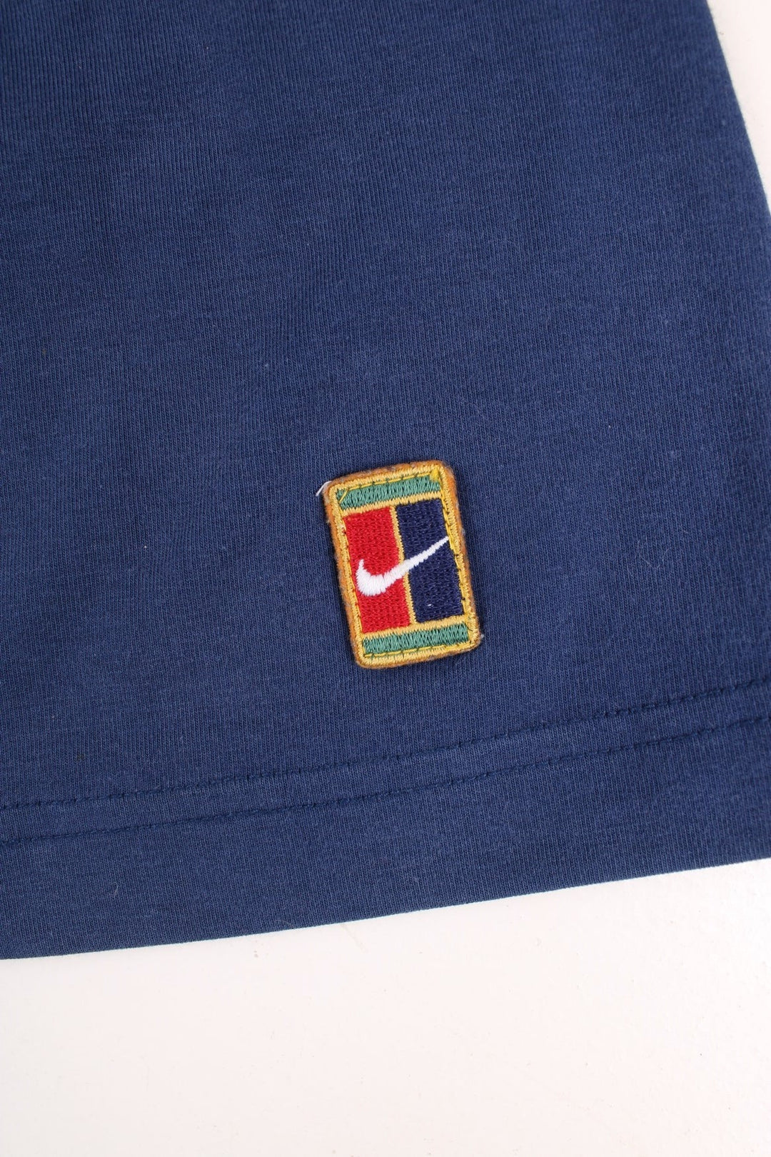 Vintage Nike mini skirt in navy with logo embroidered on the front.