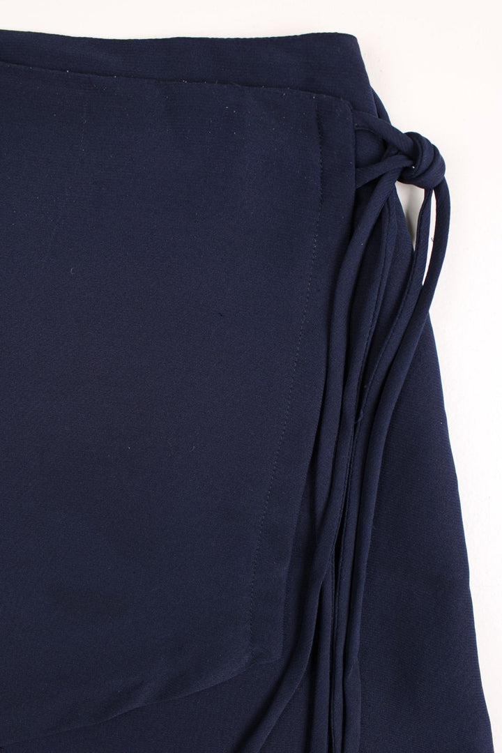 Y2K wrap skirt in navy with double tie wrap detail.