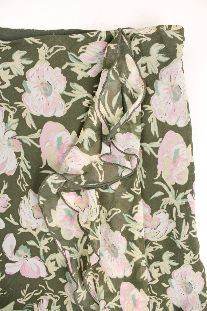 Laura Ashley floral midi skirt in green with pink flowers and ruffle detail.