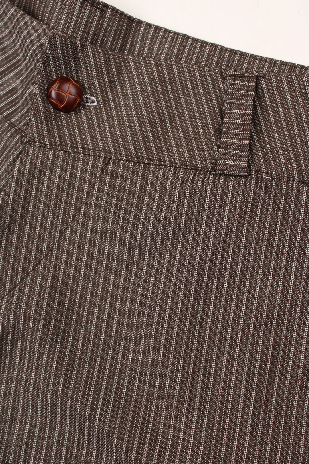 Y2K pinstripe shorts in brown with pockets and button and zip closure.