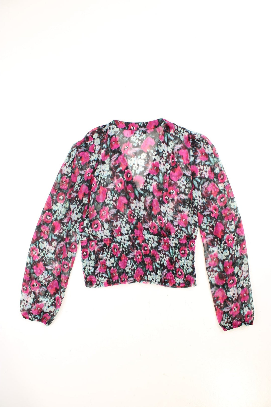 Morgan de Toi blouse in black with a hot pink and blue floral pattern, button closure and shirred hem at the back.