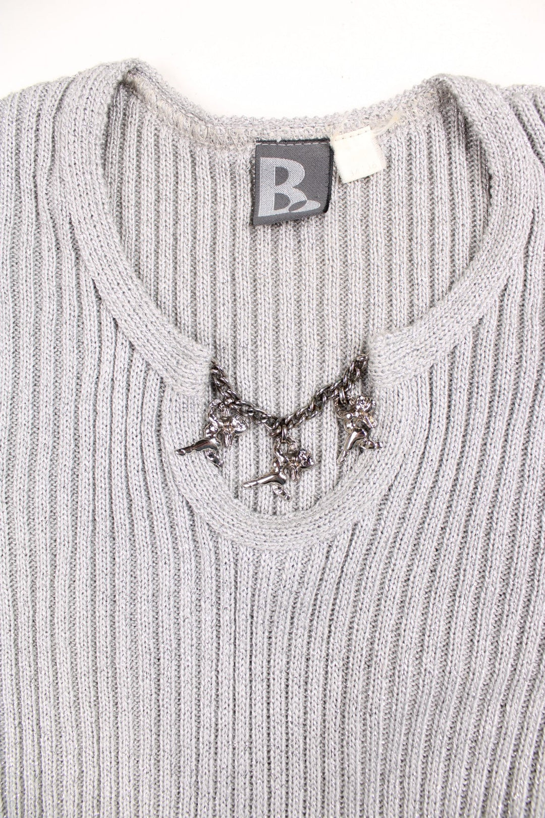 Y2K short-sleeved knit top in a stretchy ribbed grey fabric with silver sparkles and a silver chain across the neckline with three cherub charms. 