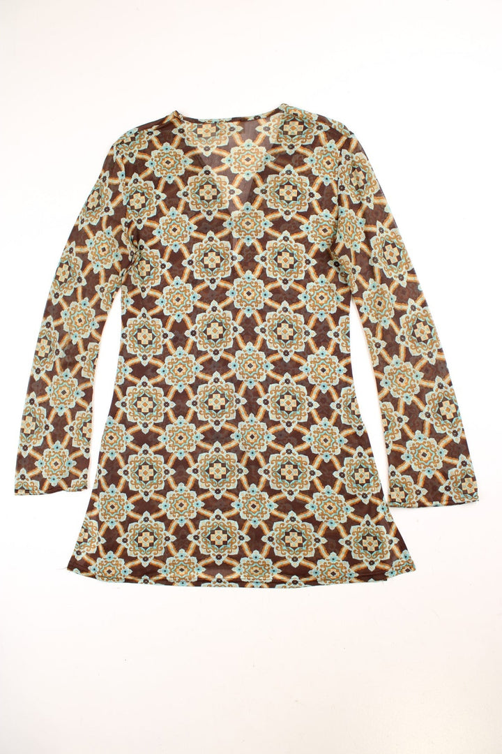 Y2K Morgan de Toi mesh tunic top in brown with a blue geometric pattern, one button, fluted sleeves and a split hem at both sides.