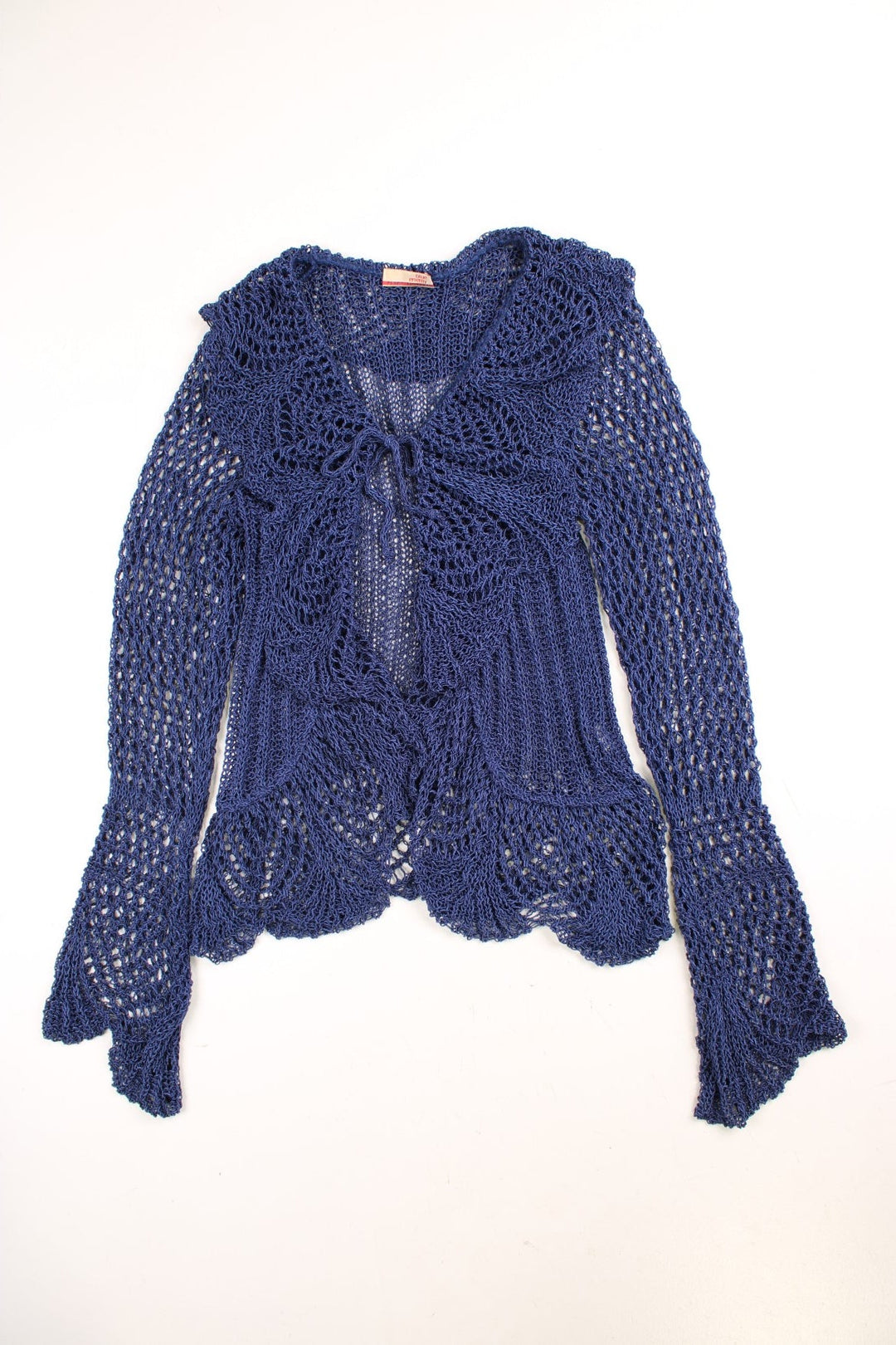 Y2K crochet top in blue with a ruffled collar, fluted sleeves, and tie-up closure.