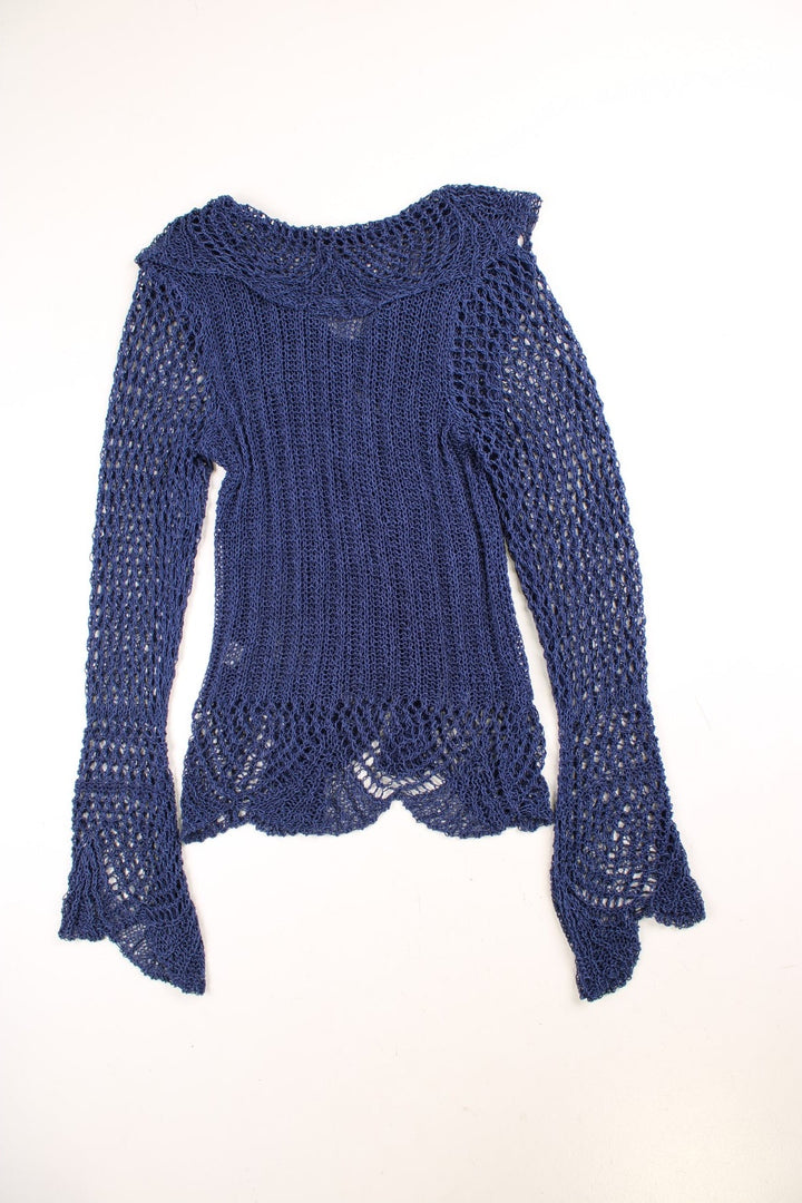 Y2K crochet top in blue with a ruffled collar, fluted sleeves, and tie-up closure.