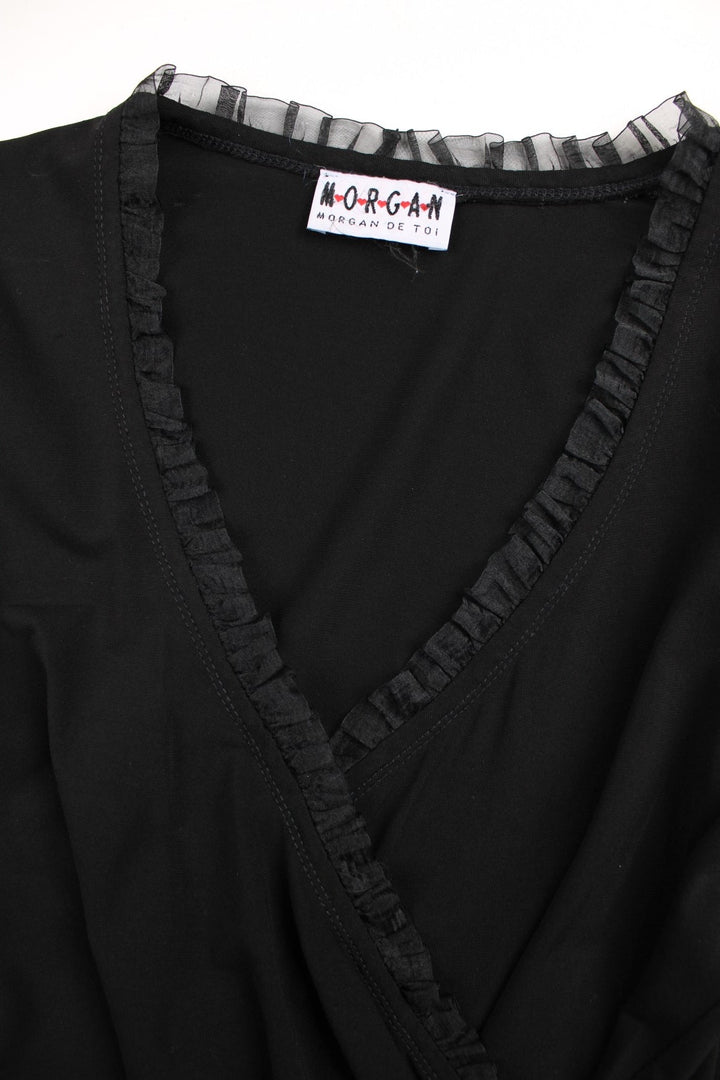 Y2K Morgan de Toi wrap top in black with ruching, a frilly tulle trim and a small logo tag on the hem..