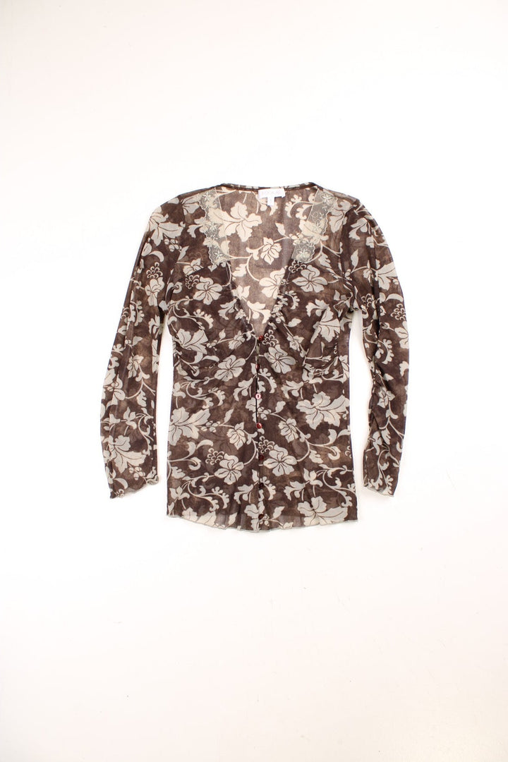 Y2K Kookai mesh top in brown with a white floral print, button closure, and a white lace trim around the neckline.