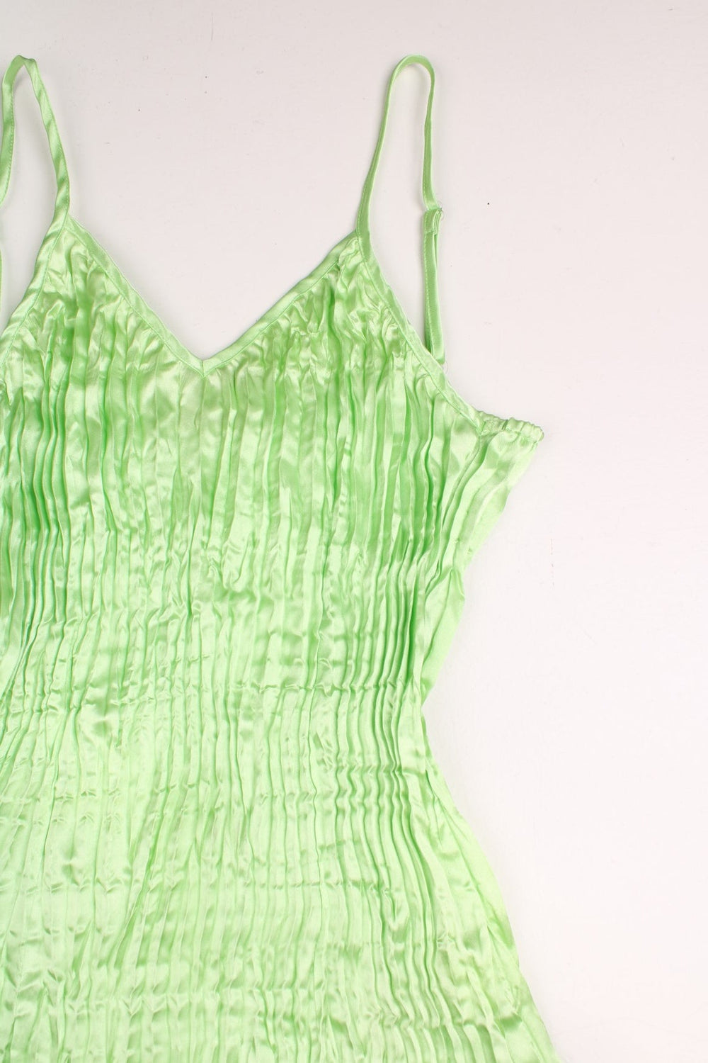 Y2K cami top in shiny green pleated fabric by Savida. 