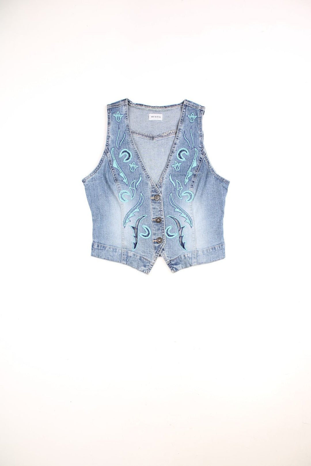 Moto blue denim vest top with cutouts and blue beaded designs on the front. Matching beaded denim skirt available. 