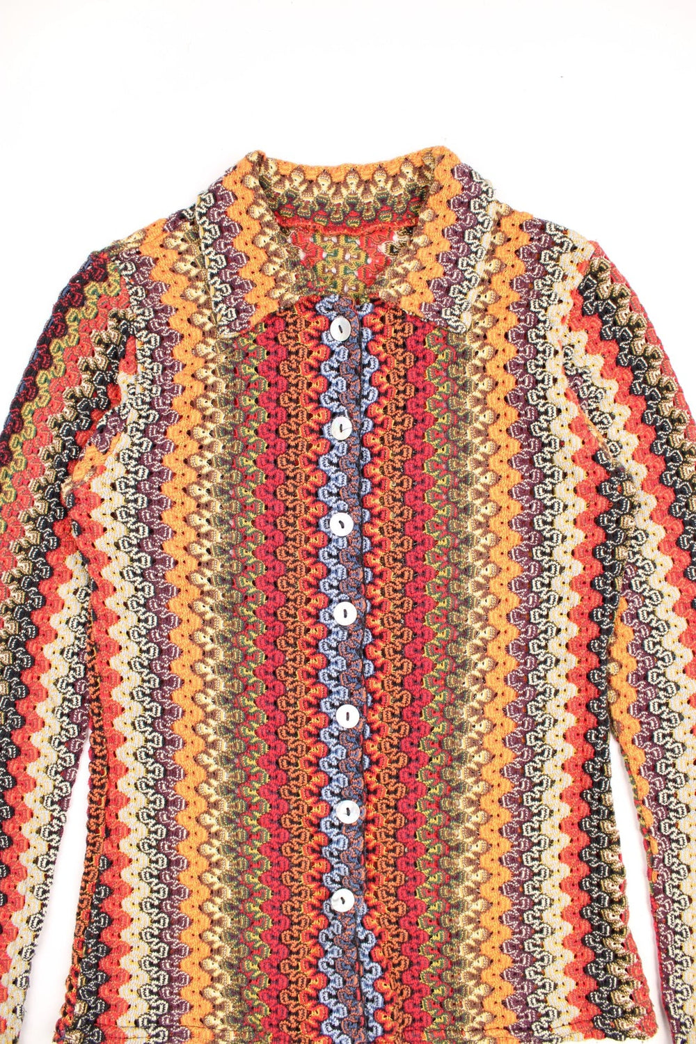 Collared crochet top with a multicoloured zig-zag vertical stripe pattern and real mother of pearl buttons.