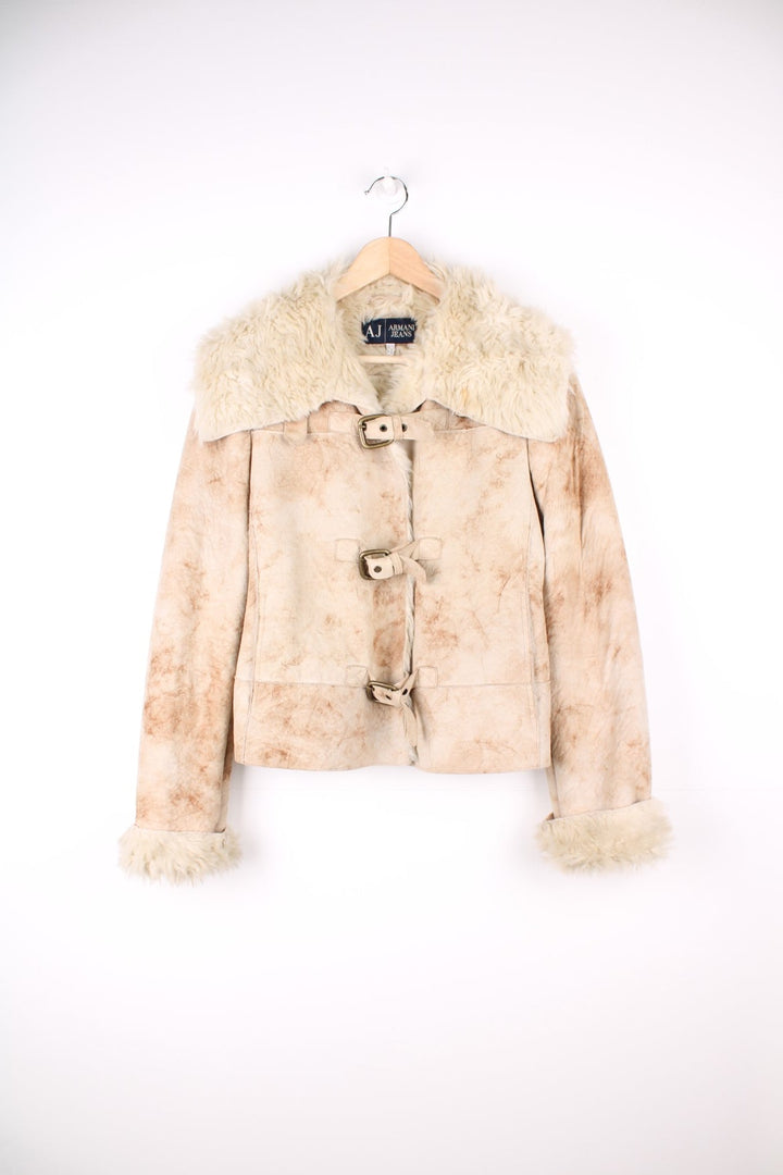 Armani Jeans Faux Fur Shearling Jacket in a tanned colourway, buckle up with side pockets, big faux fur collar, and has the logo embroidered on the back.