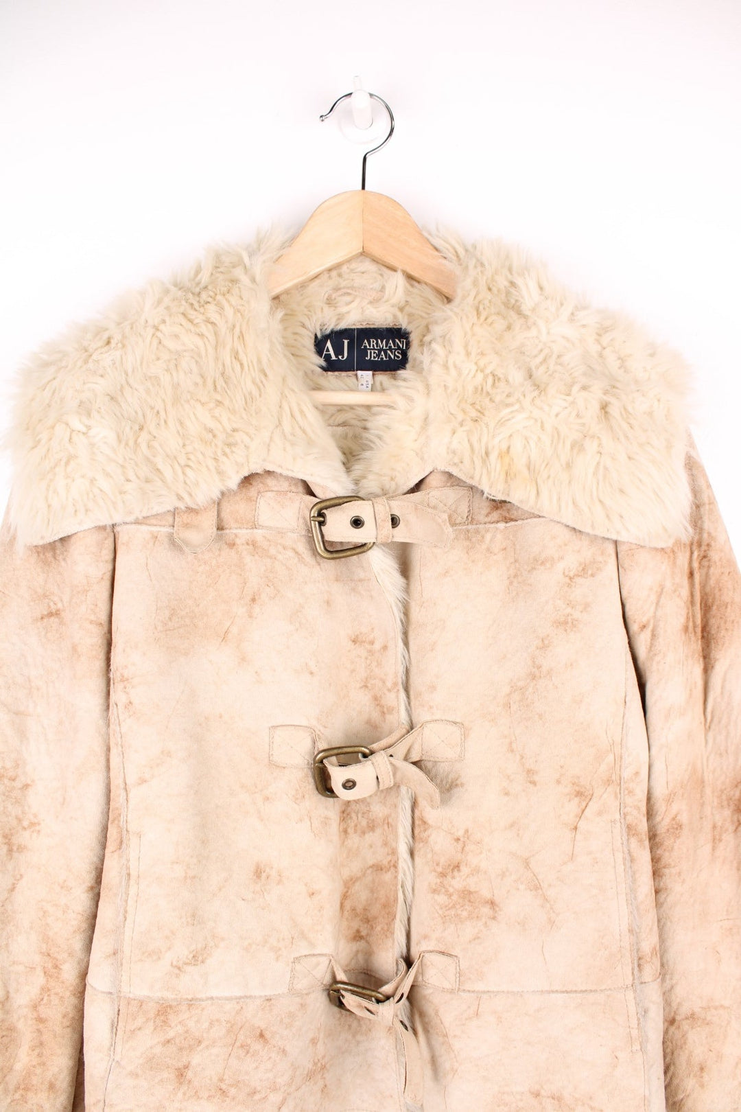 Armani Jeans Faux Fur Shearling Jacket in a tanned colourway, buckle up with side pockets, big faux fur collar, and has the logo embroidered on the back.